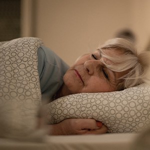A woman resting in bed